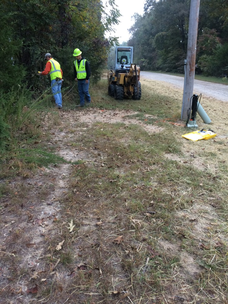 Crew finding existing lines before installing replacement fiber to house.