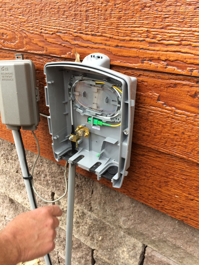 Fiber cable terminated into service box on the house.